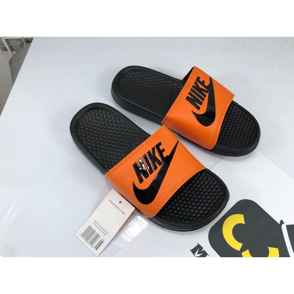 orange nike slippers